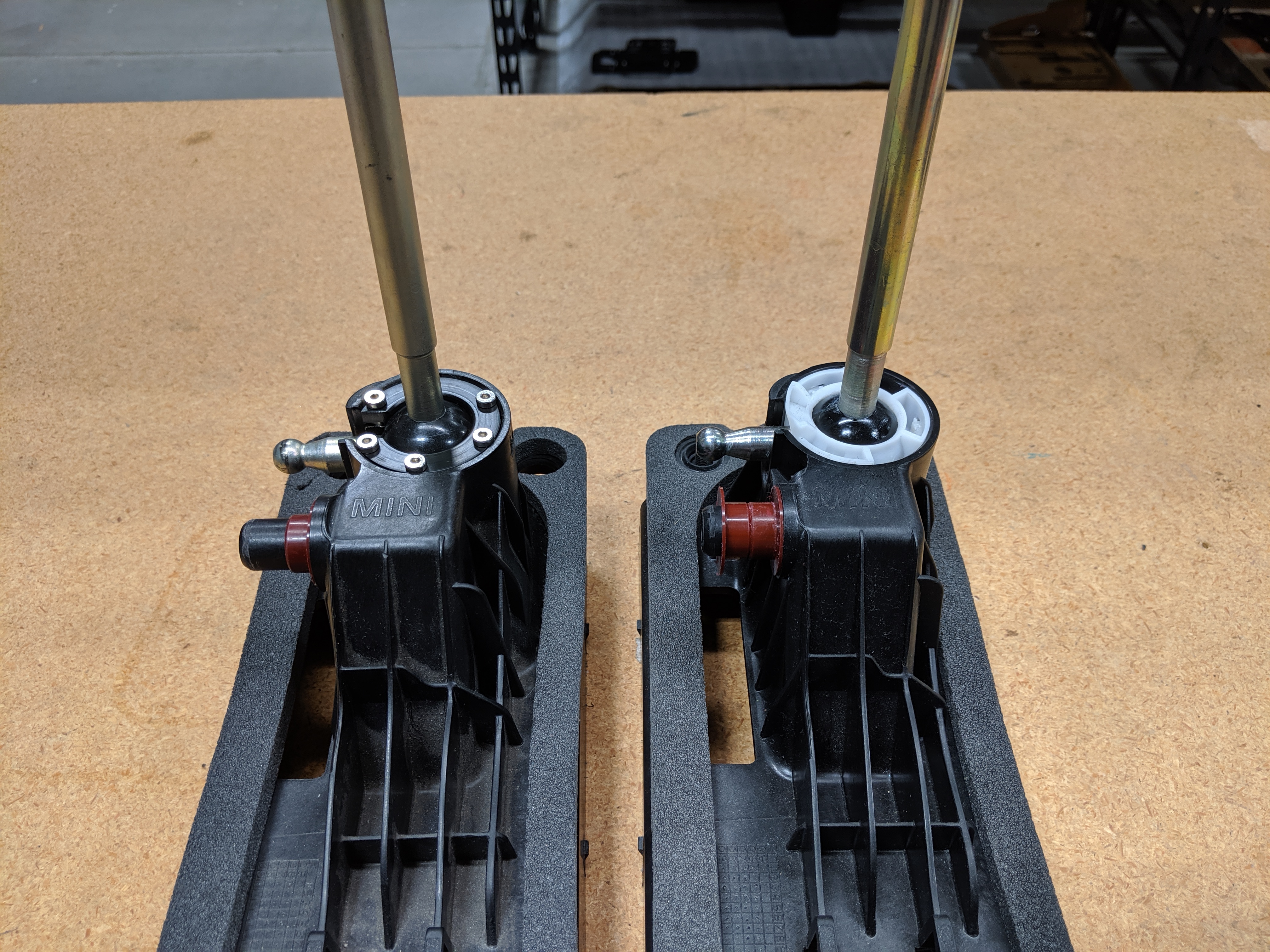 Housing with machined clip and OEM clip side by side.