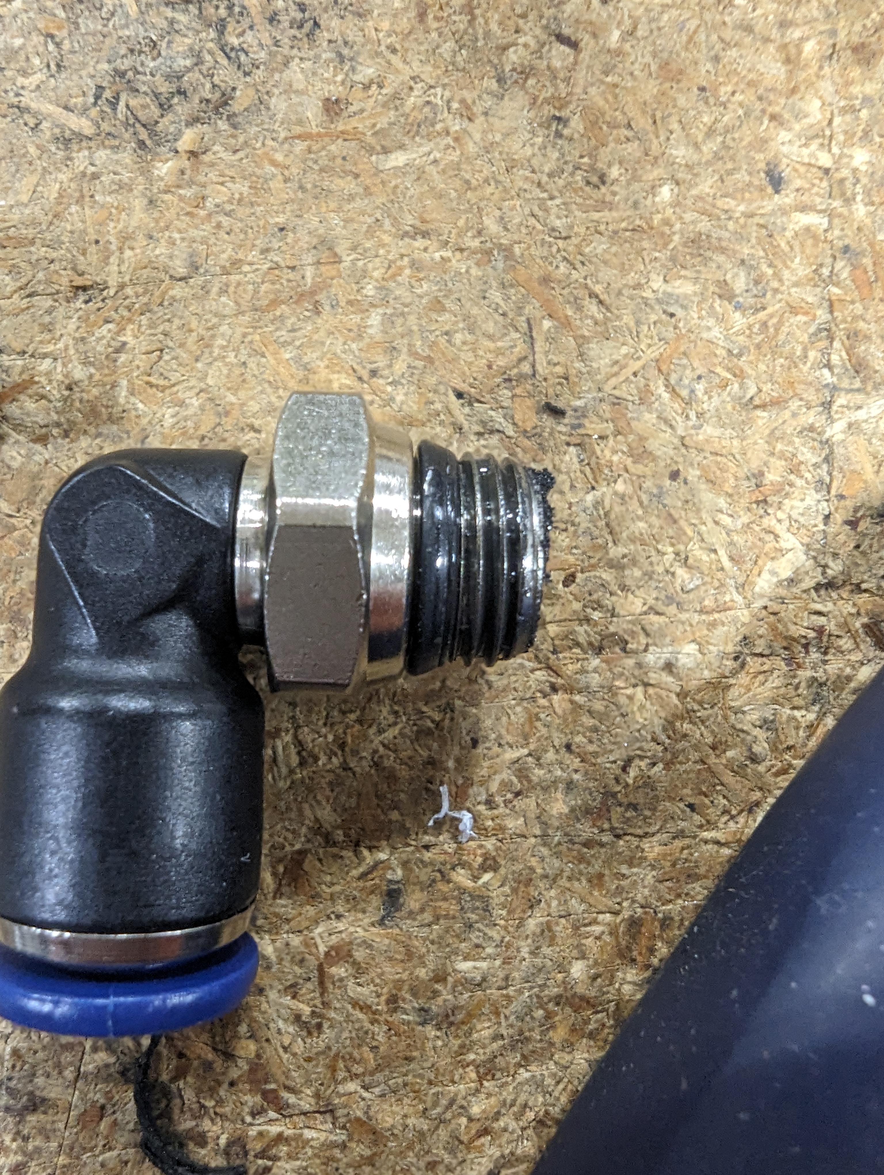 a thick sludge coats the end of a compression fitting