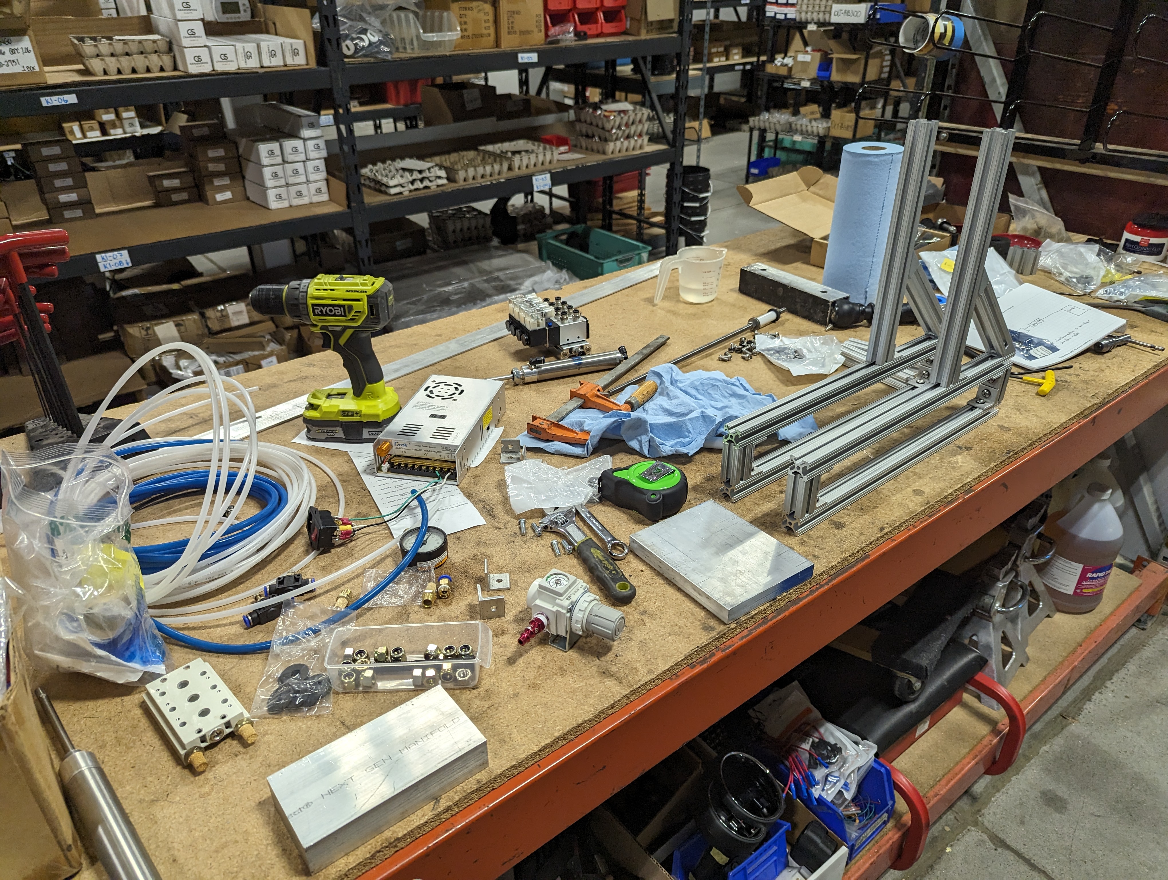 Our messy work bench and the two sides of the machine assembled
