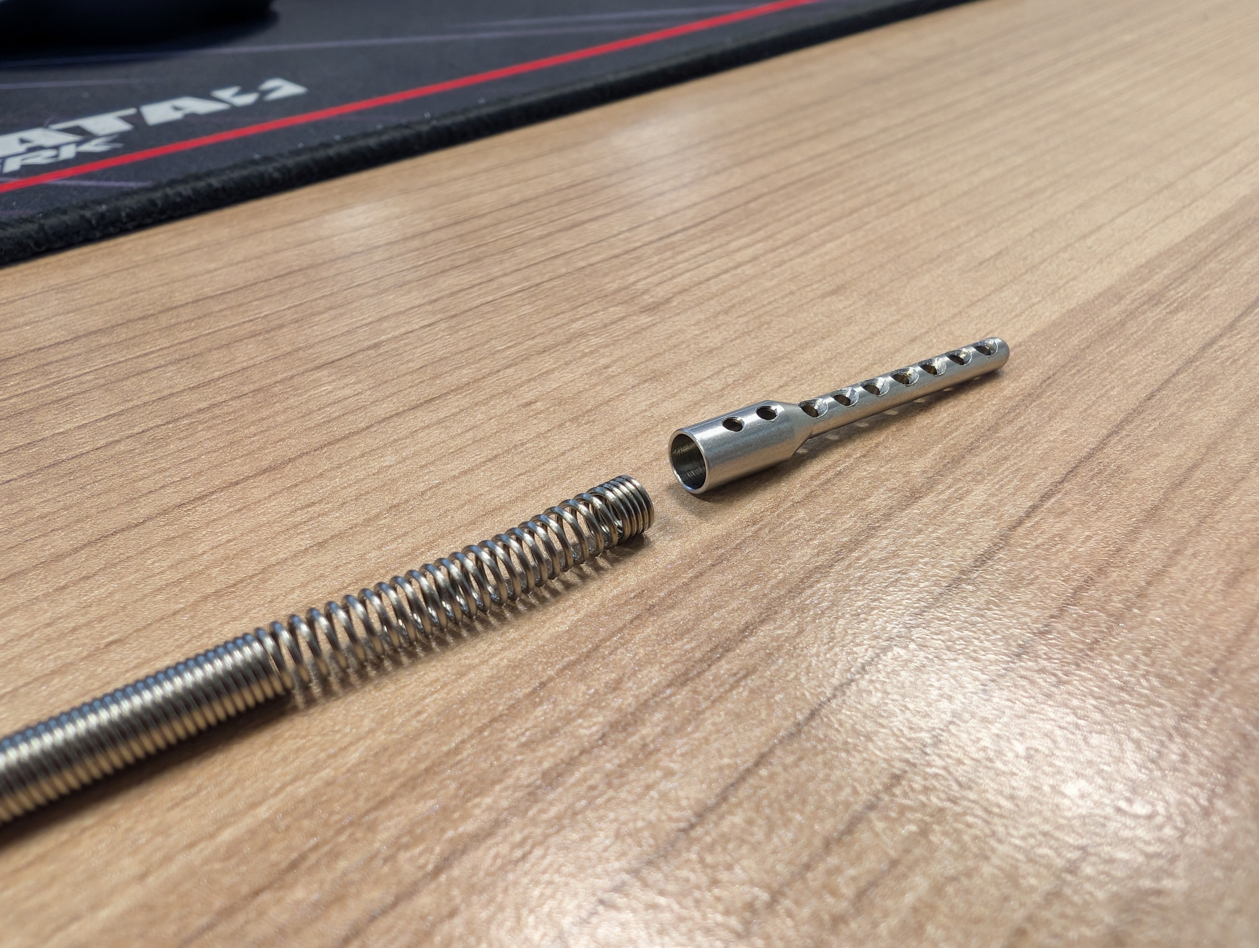 The counterfeit dipstick with the sinker removed by simply pulling it off by hand.