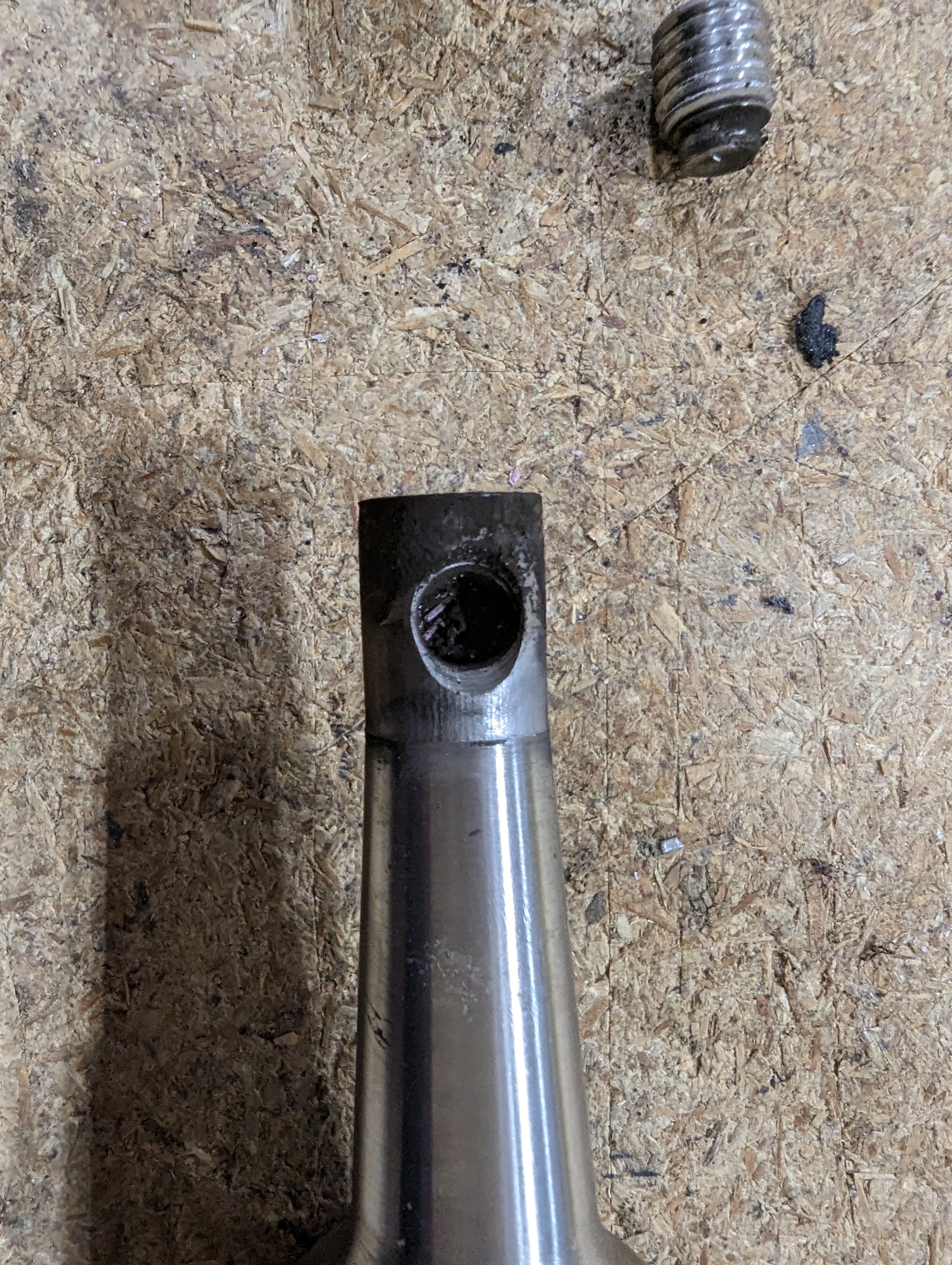 The bottom end of the shifter shaft, covered in a fine steel dust