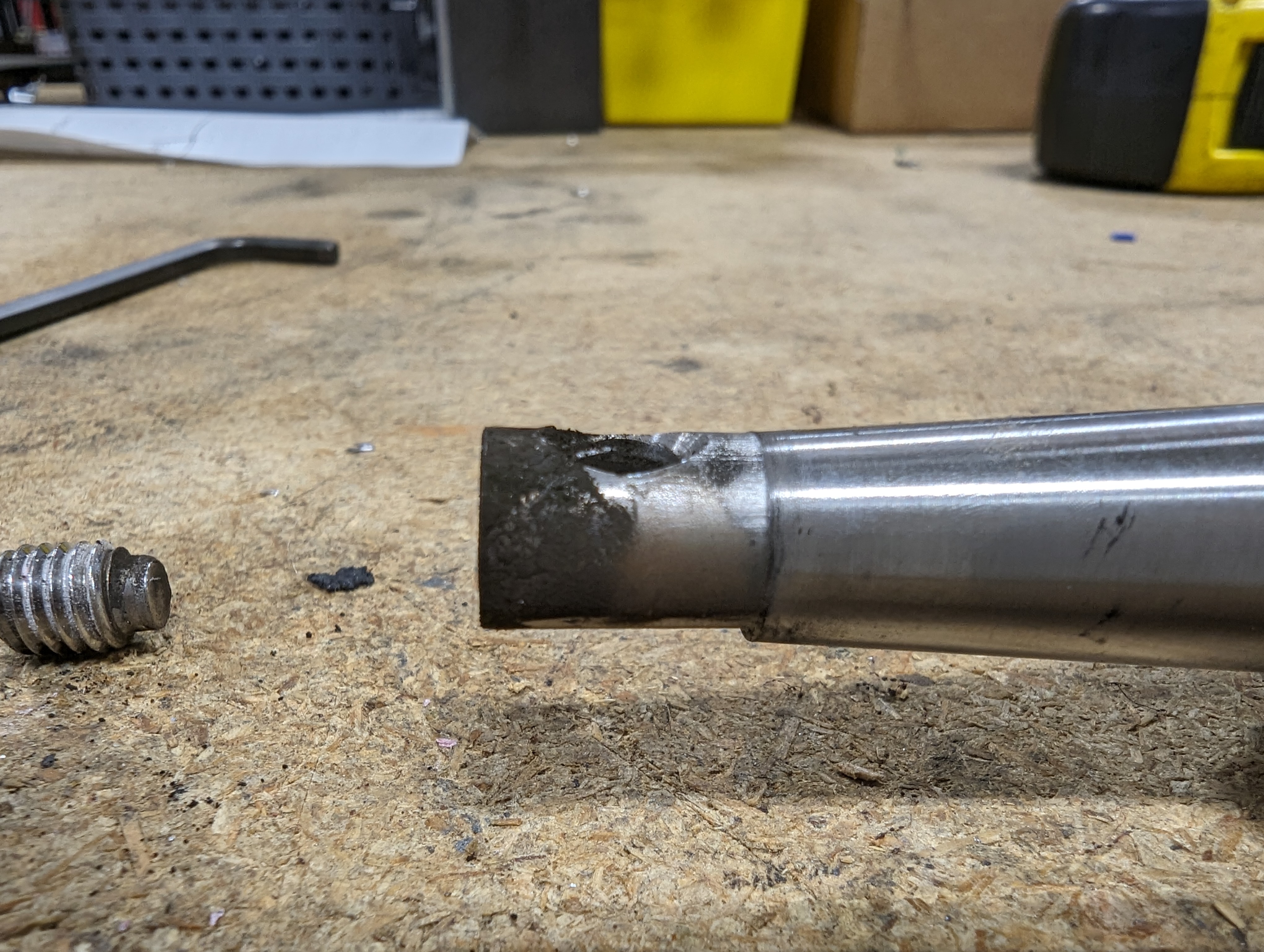 The bottom end of the shifter shaft, covered in a fine steel dust