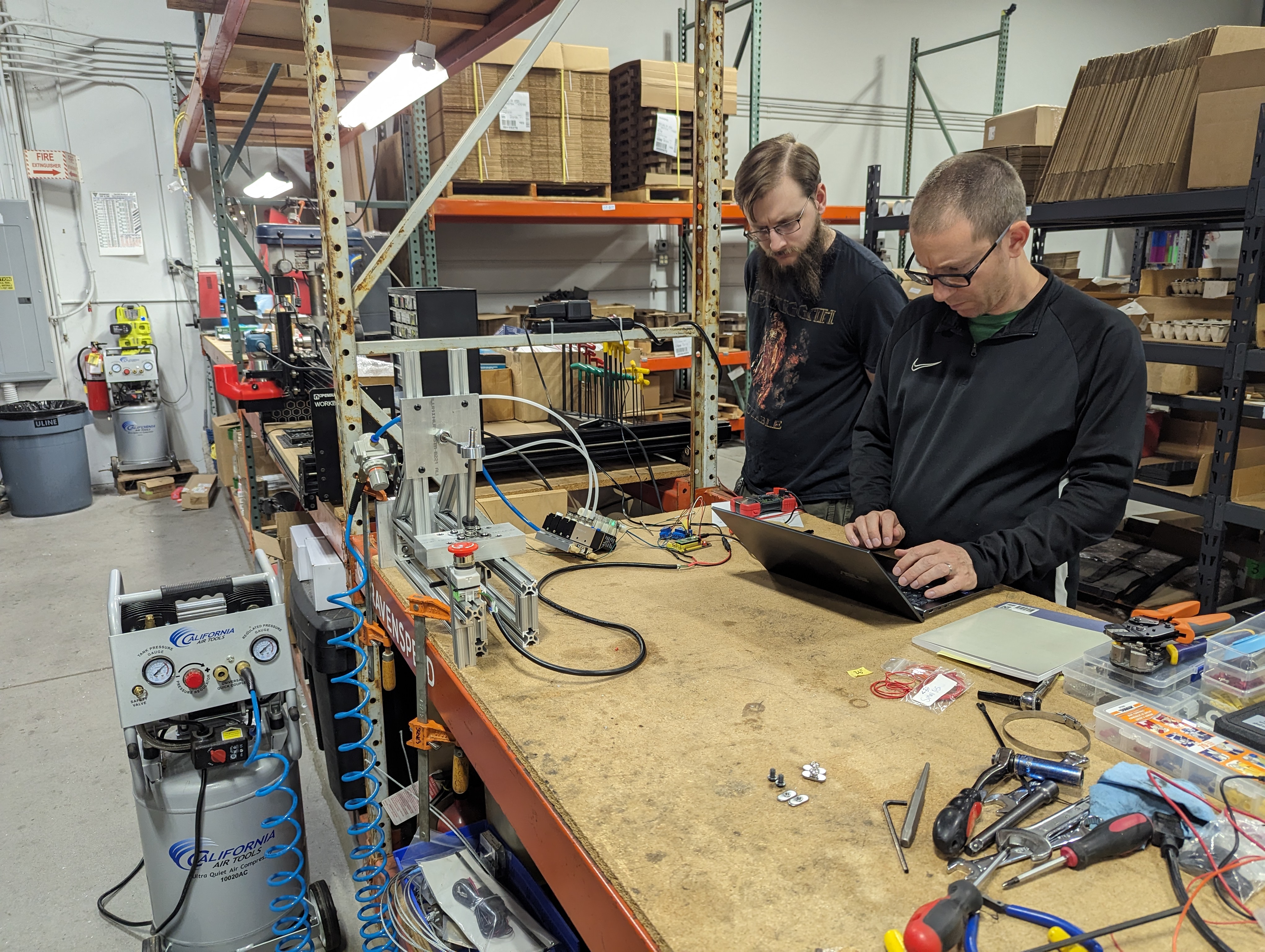 Tristan and Jacob at the workbench troubleshooting the PiPico