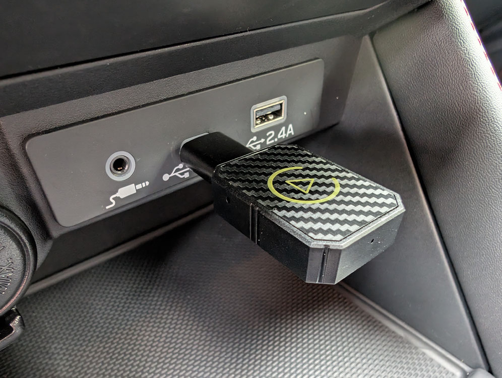 A dongle type device installed with a USB-A to USB-C adapter